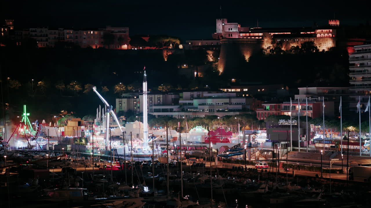 Aerial view of the Port Hercule Funfair in Monaco at night