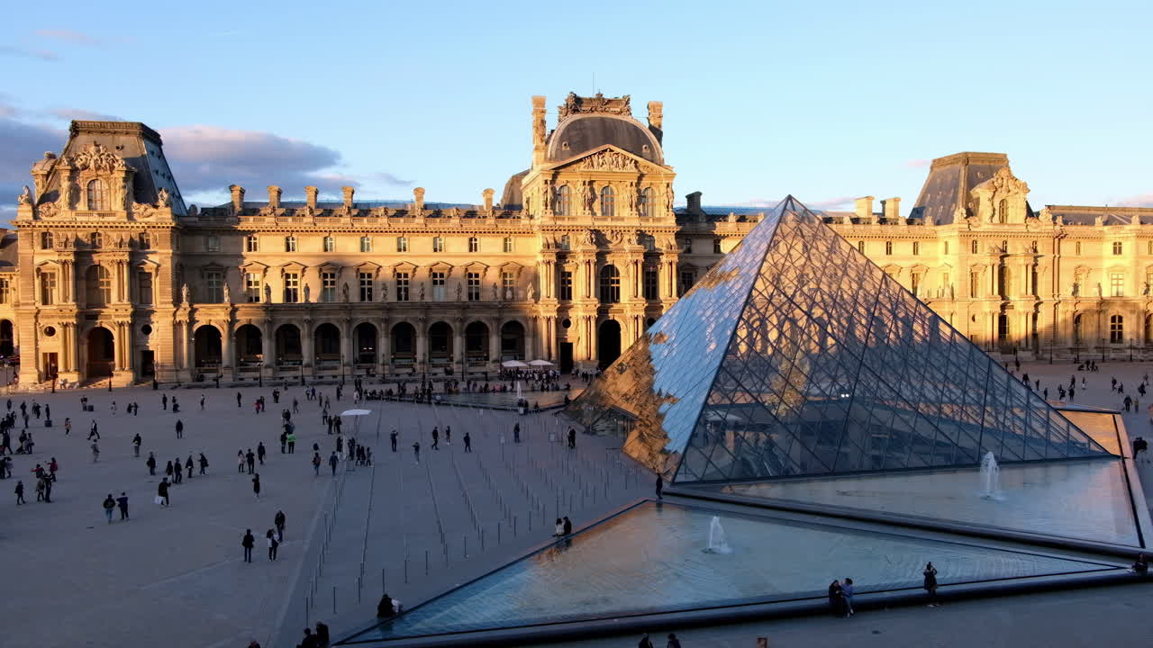 Paris, France - November 21, 2021: Front view of the Louvre Museum at sunset