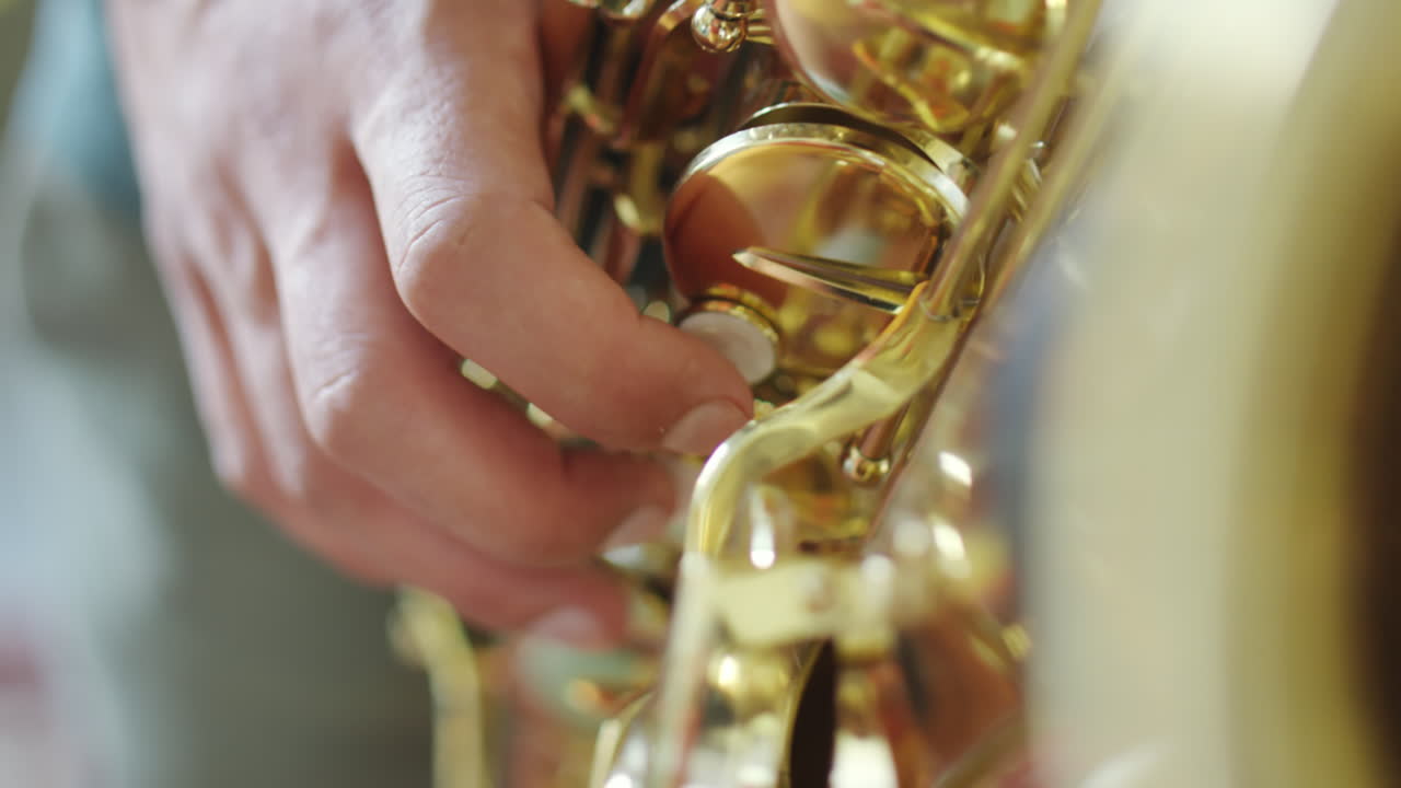 Close-up of a hand playing a saxophone