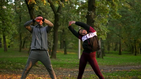 couple exercising outdoors in park
