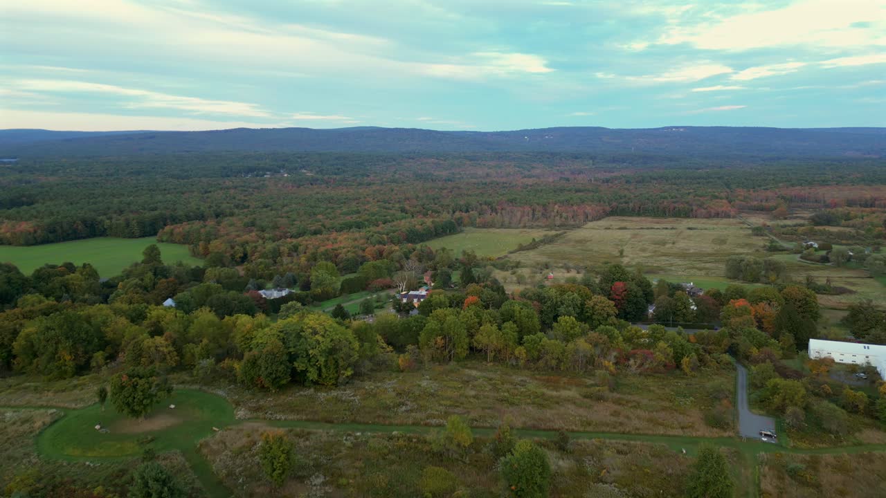 Aerial panoramic sideview over Mount Pollux scenic lookout in Amherst Massachusetts at sunset