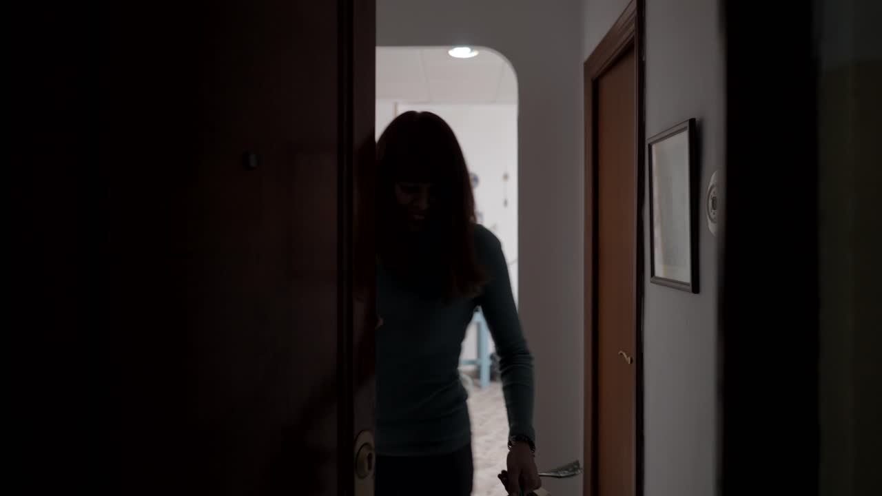Woman walking through hallway
