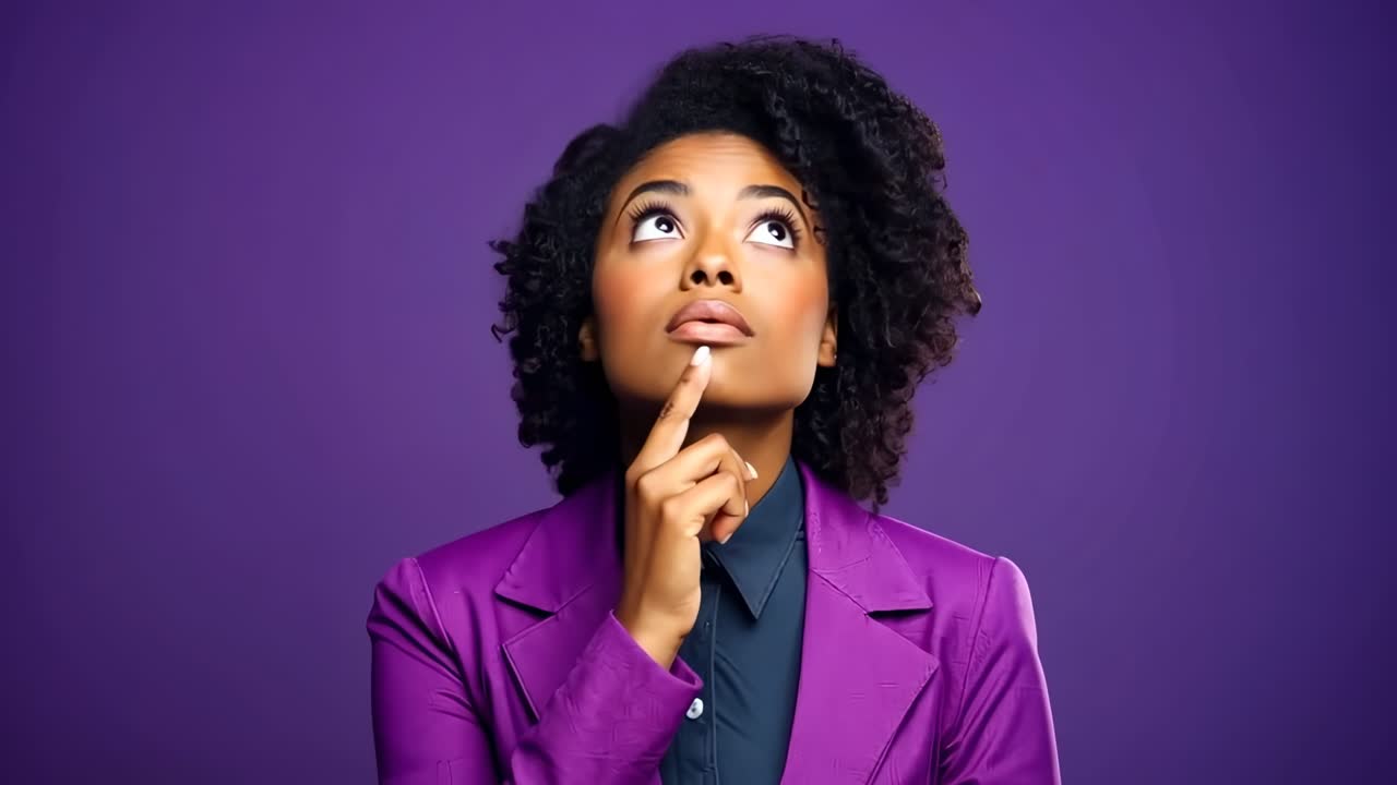 A thoughtful woman in a purple blazer gazes upward against a purple backdrop