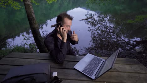 talking on the phone in the forest.