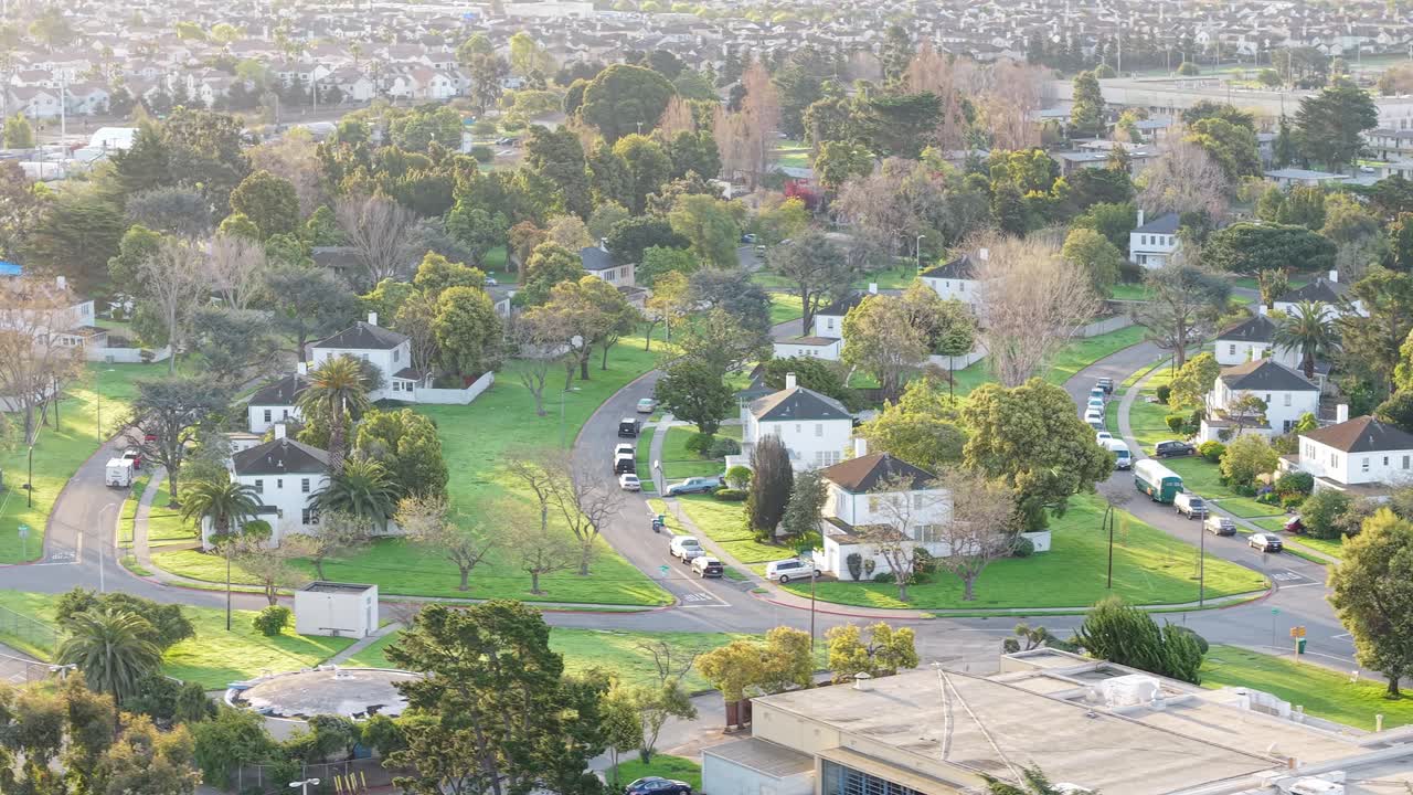 Panning bird's eye view from a drone capturing the neighborhood of Alameda Point.