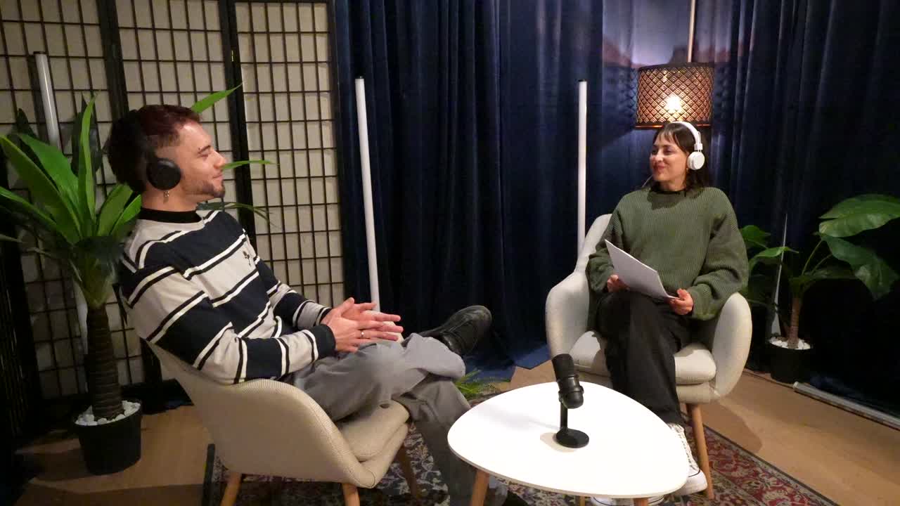 Three Young Adults Recording a Podcast or Interview in a Studio