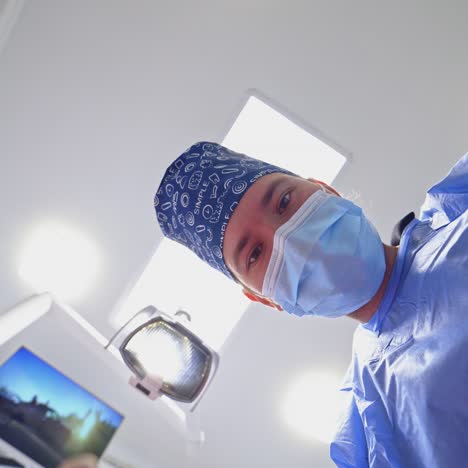 surgeon holding medical instruments