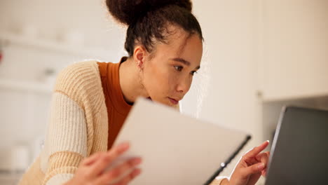 woman, student notes and computer research in home