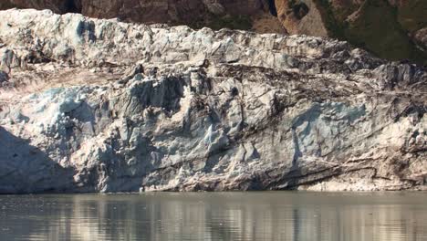 black sediments in the ice of the glacier in alaska