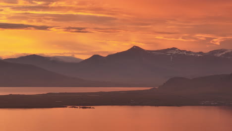 yellow golden colourful sky over mountains in iceland aerial view