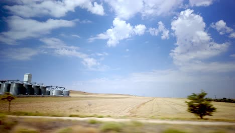 agricultural silos under a blue sky