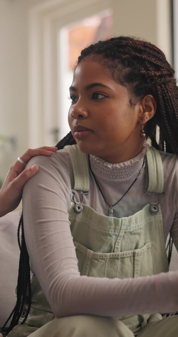 Young Woman Receiving Comfort and Support from a Friend