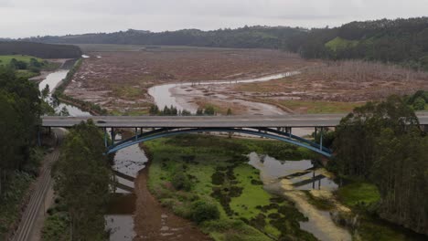 Aerial-Panoramic-Drone-Above-Highway-A8-Traffic,-Rubin-Marsh-Cantabria-Landscape-Natural-Flooded-Land-between-Rivers,-San-Vicente-de-la-Barquera