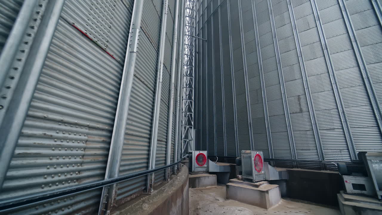 Food industry agricultural tank. Huge steel elevator storage.