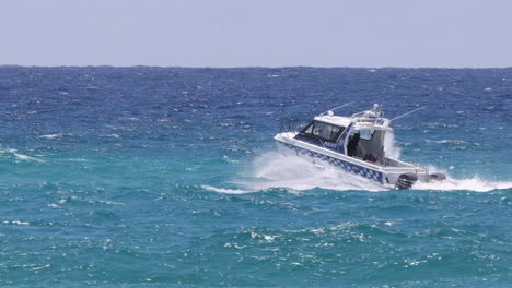 speedboat maneuvers swiftly through choppy ocean waves