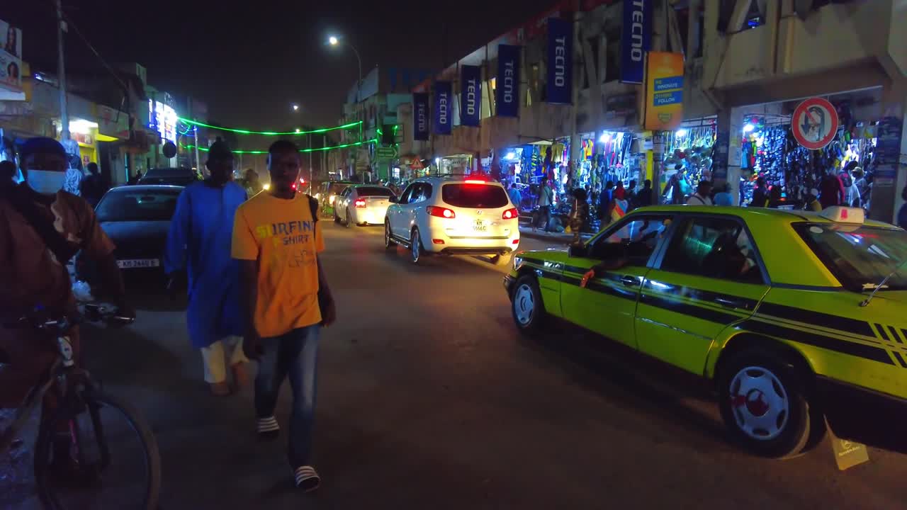 Night view of main Serekunda Market street traffic