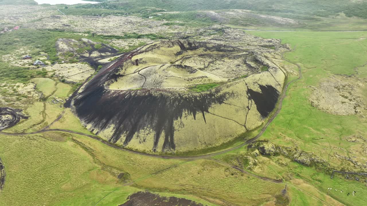 Aerial top down of grabrok crater volcano in idyllic green landscape of Iceland. Peaceful and natural shot of erupted volcano