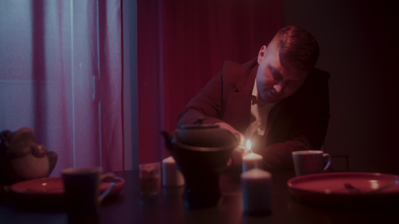 Man enjoying a warm drink at night