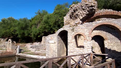 Gladiator's-Respite:-Visiting-the-Remaining-Stone-Walls-of-Gladiator-Rooms,-Immersed-in-the-Rich-History-of-Butrint's-Archaeological-Site