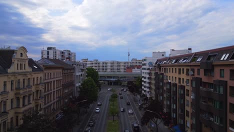 flock of pigeons flies lovely aerial top view flight city berlin suburban railroad station prefabricated building skyscrapers district neukoeln, germany summer day 2023