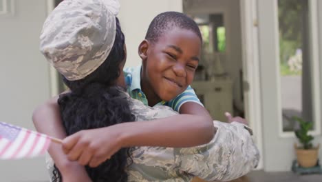 montage of african american female and male soldiers embracing children