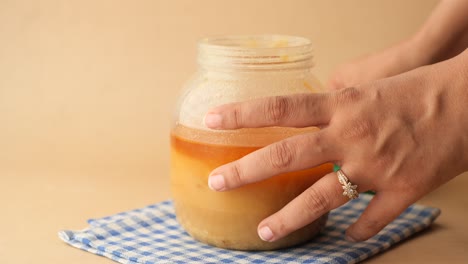 homemade ghee in container on a table