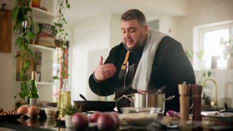 man cooking in kitchen