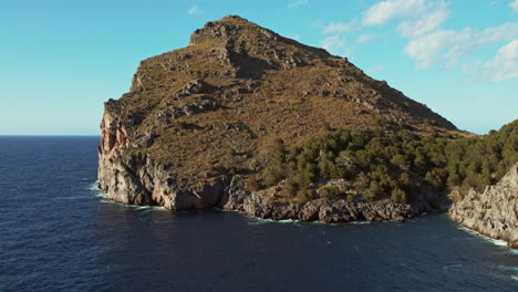 scenic view of massive rock mountains at sa calobra beach in the balearic islands of spain, mallorca