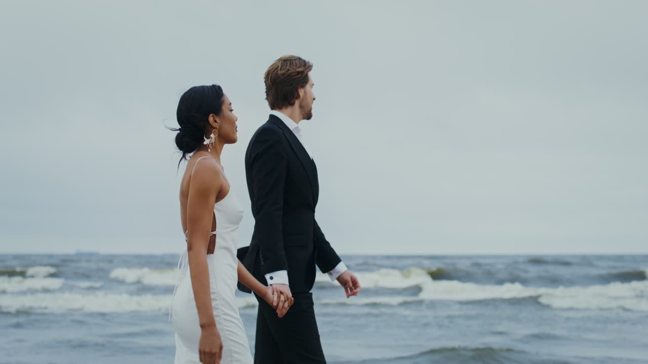 A couple celebrating their wedding on the beach