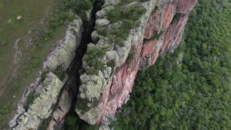 flyover of tall limestone escarpment cliff in rugged central bolivia