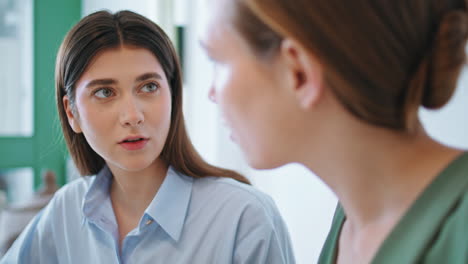 two employees working project together closeup. worried woman talking smartphone