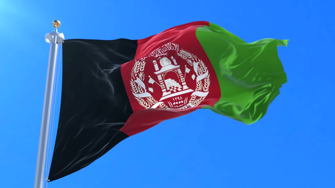 Afghanistan flag waving at wind in slow with blue sky, loop