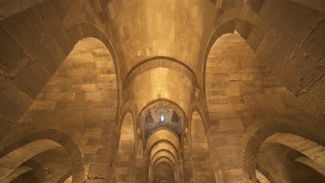 interior of historical monumental building with stone arches and domes