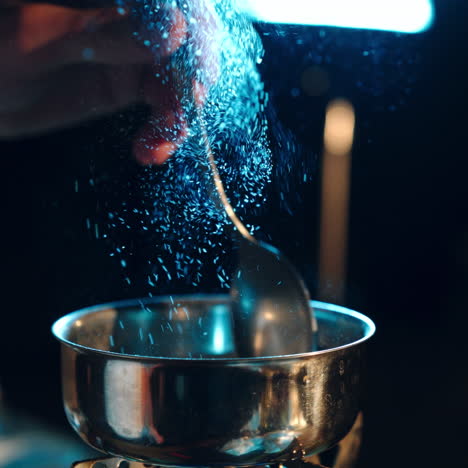 young man preparing a drug. man holds a spoon over a cigarette lighter. drugs and the concept of crime.