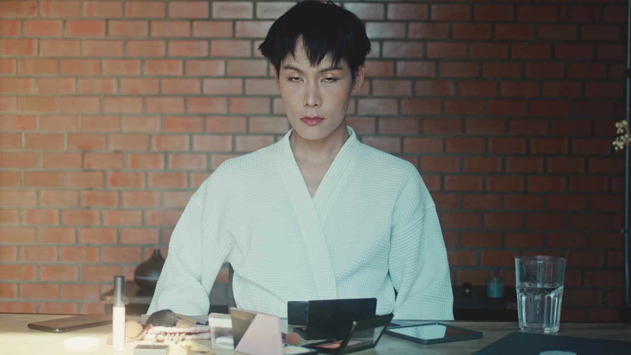 Person applying makeup at home