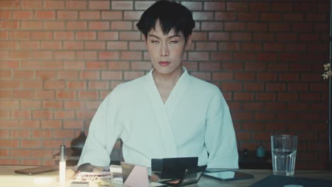 person applying makeup at home
