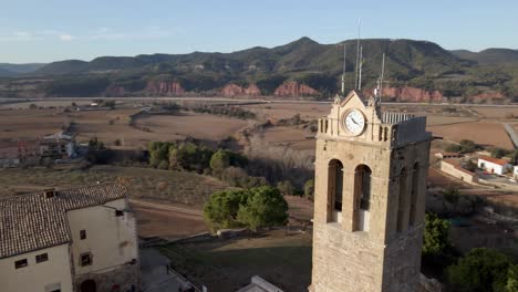 panning on a church tower with the sun coming in and a landscape in the background