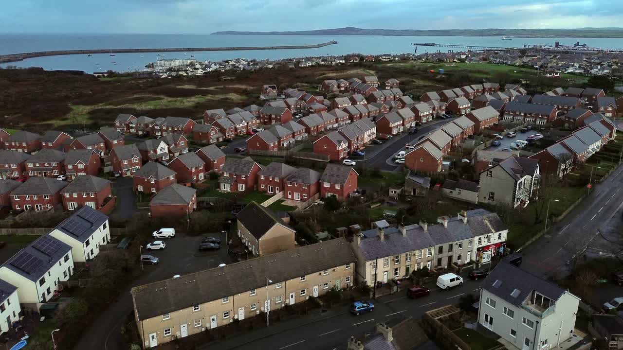 Rainy Holyhead homes aerial view overlooking small island town neighbourhood real estate properties