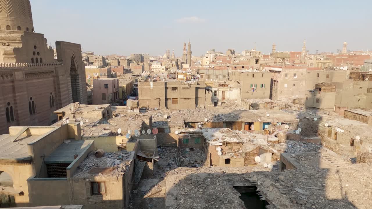 Buildings ruins in front of Sultan al-Muayyad mosque in old Cairo City, Egypt. Panning