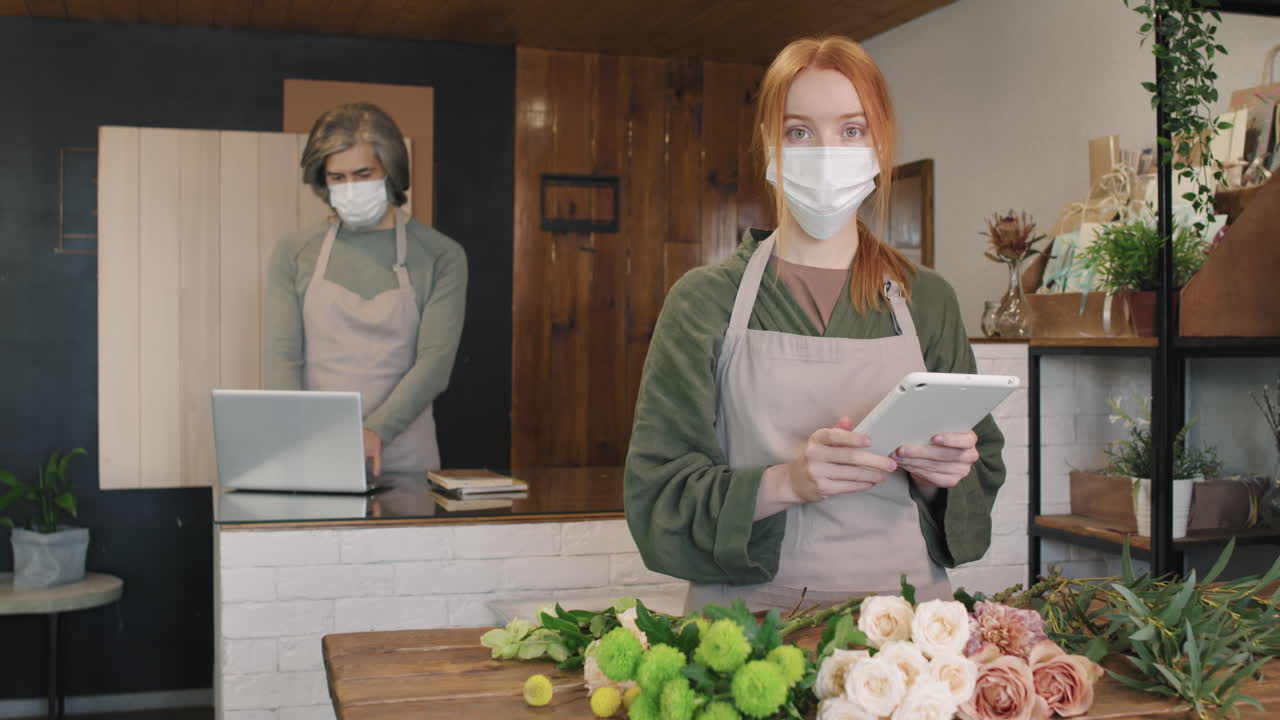 Portrait Of Female Florist In Mask