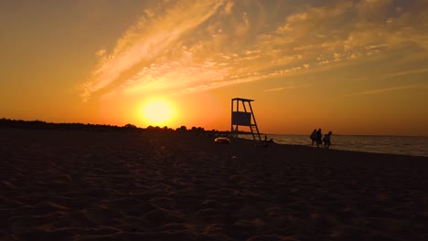 Mediterranean-beach-with-wooden-lifeguard-chair-in-sunset-time