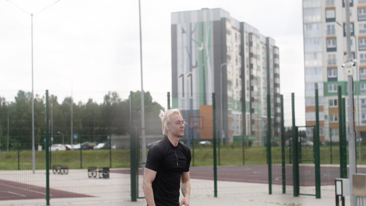 Blond man hitting a volleyball