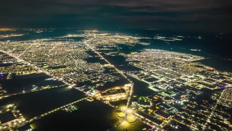 reynosa from above: night time lapse aerial view of city lights glow