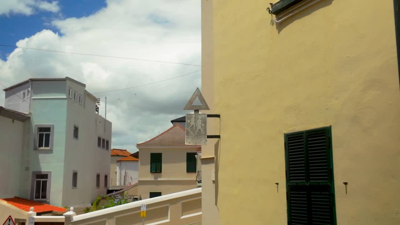School sign on a building in a European town