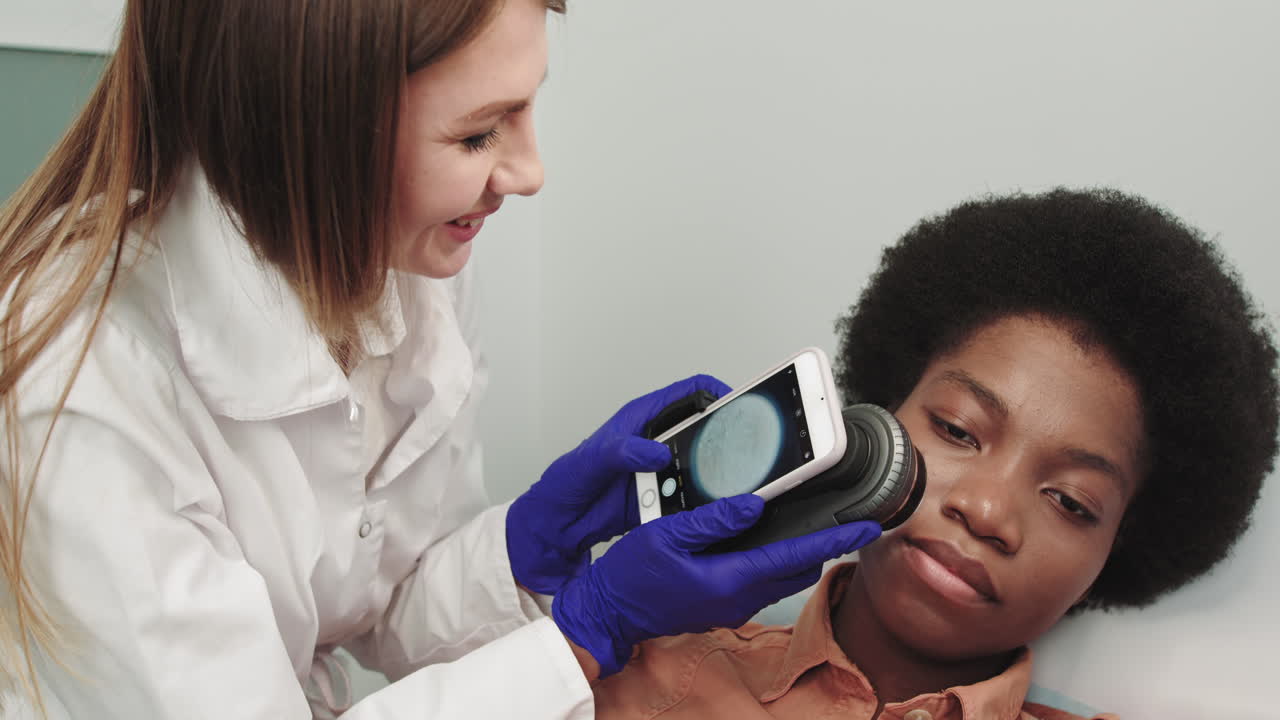 Dermatologist examines a skin a wart dermatology of a hand human skin close up professional doctor