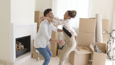 joyful young couple celebrating their move