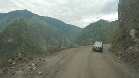 a point of view shot of driver riding through most dangerous road in shimla kinnaur road in the month of august after the landslide