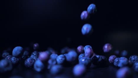 blueberries fall on the black table