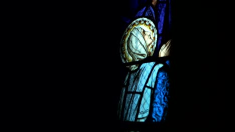 panning shot of virgin mary vitrage in old church