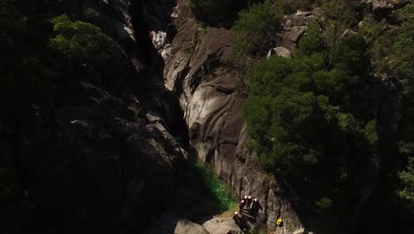 aerial view of extreme sports on mountain waterfall